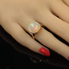 Delightful Round Opal in 18KT Gold Ring